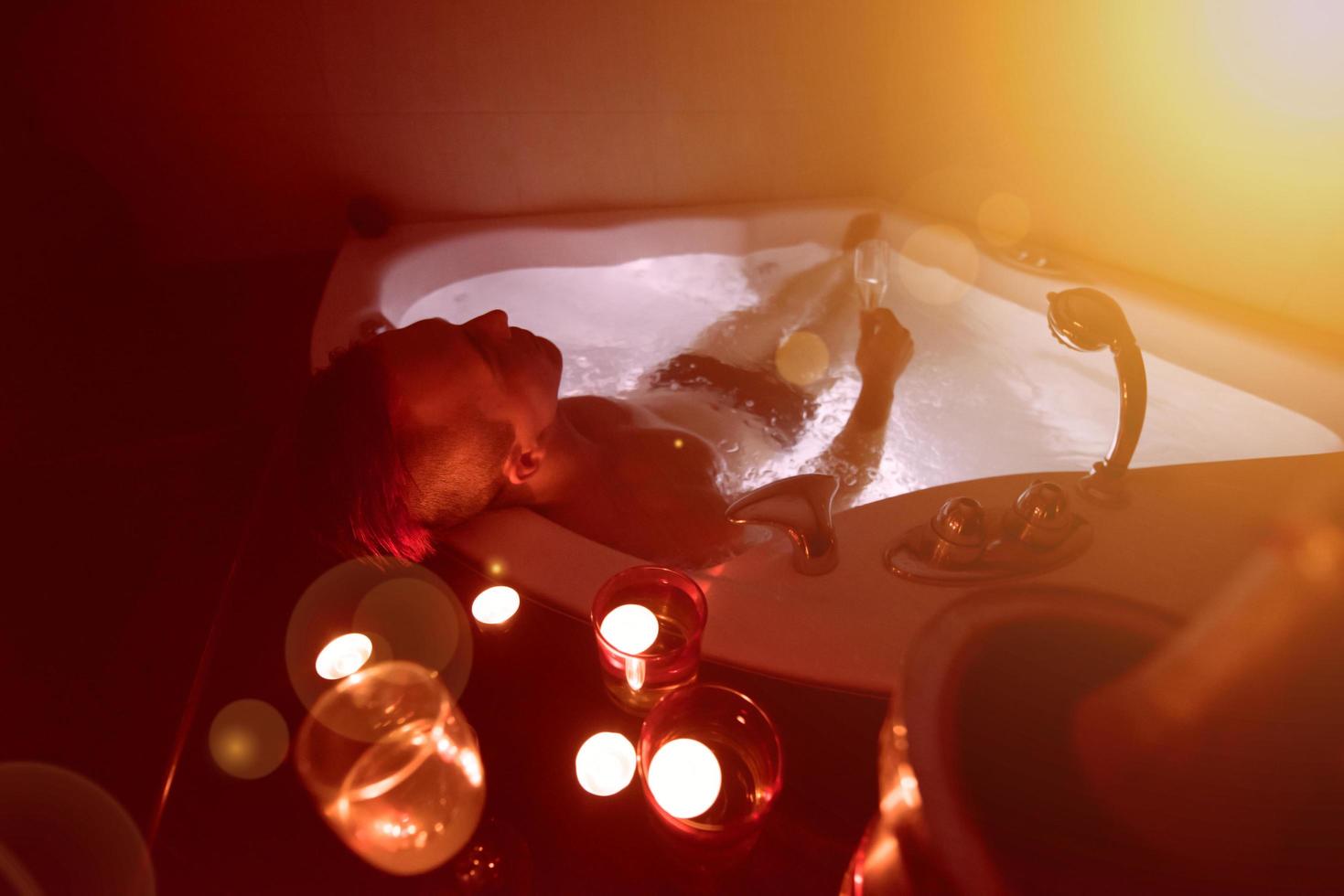 man relaxing in the jacuzzi photo