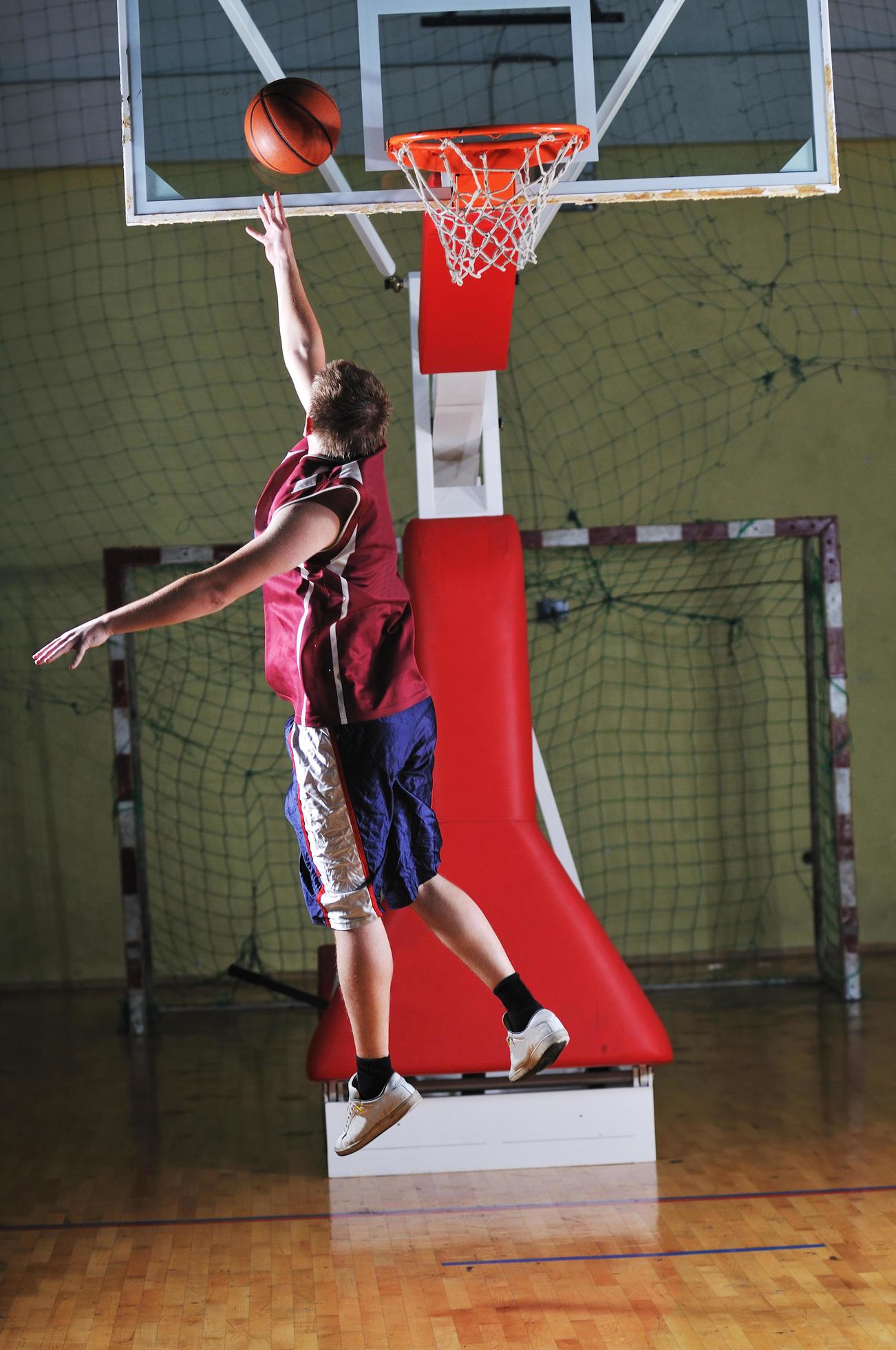 basket ball game player at sport hall 12654349 Stock Photo at Vecteezy