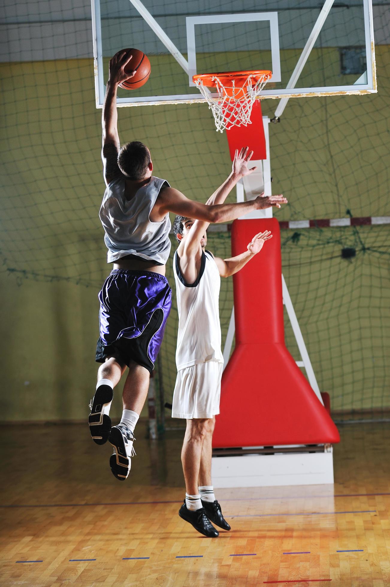 basket ball game player at sport hall 12654351 Stock Photo at Vecteezy