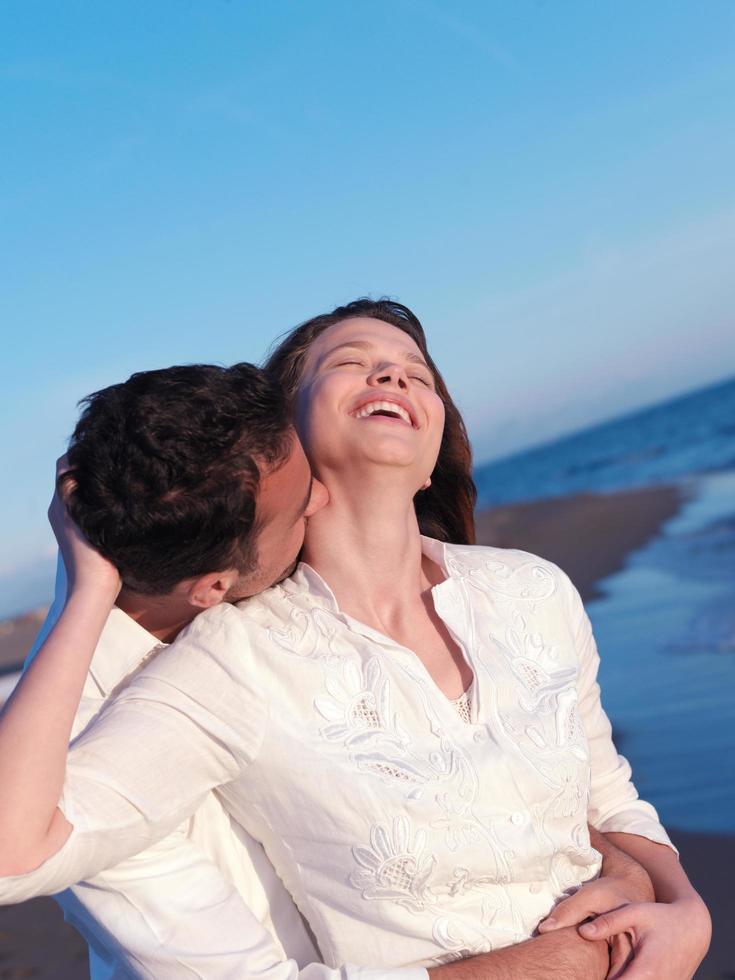 young couple  on beach have fun photo