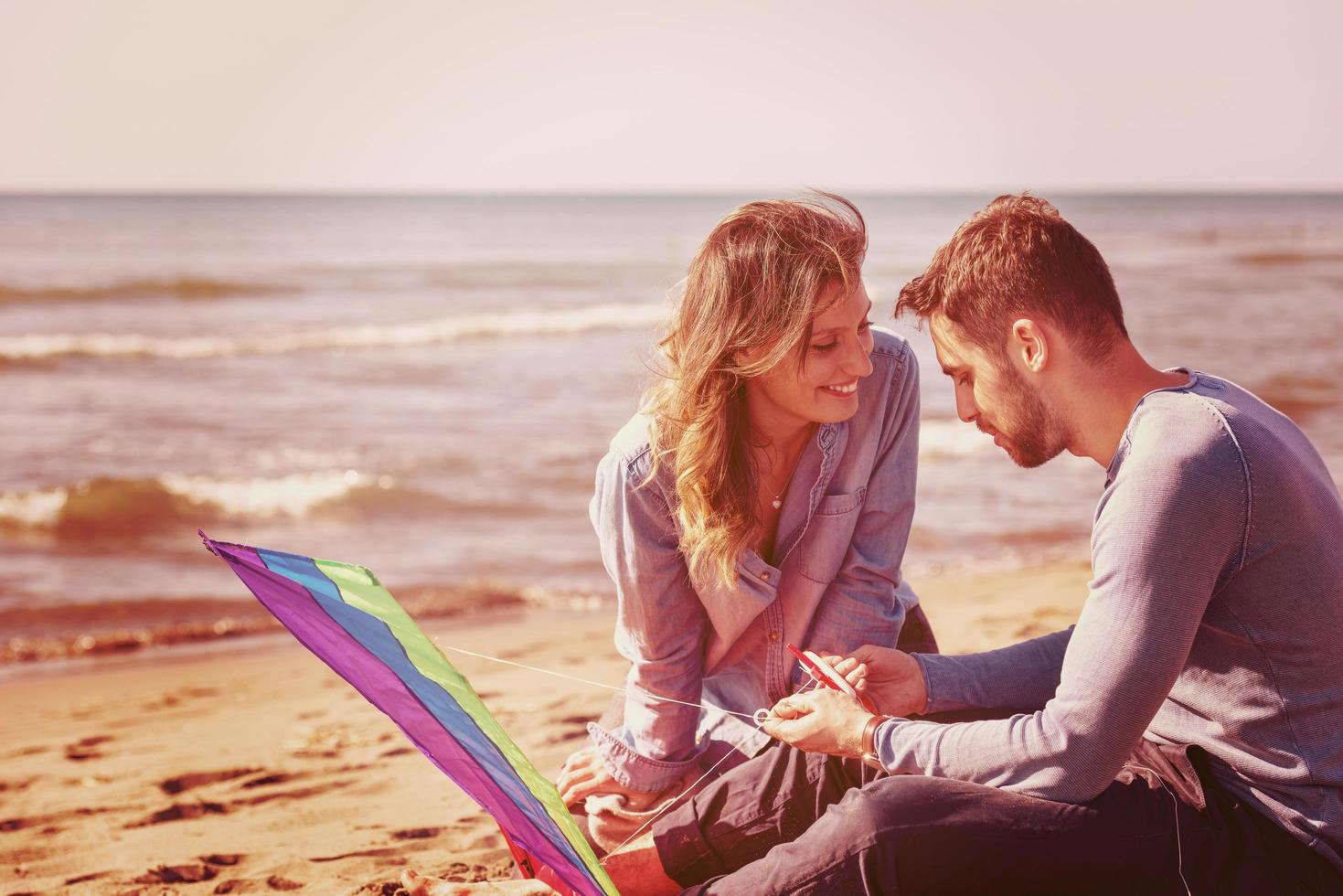Couple enjoying time together at beach photo