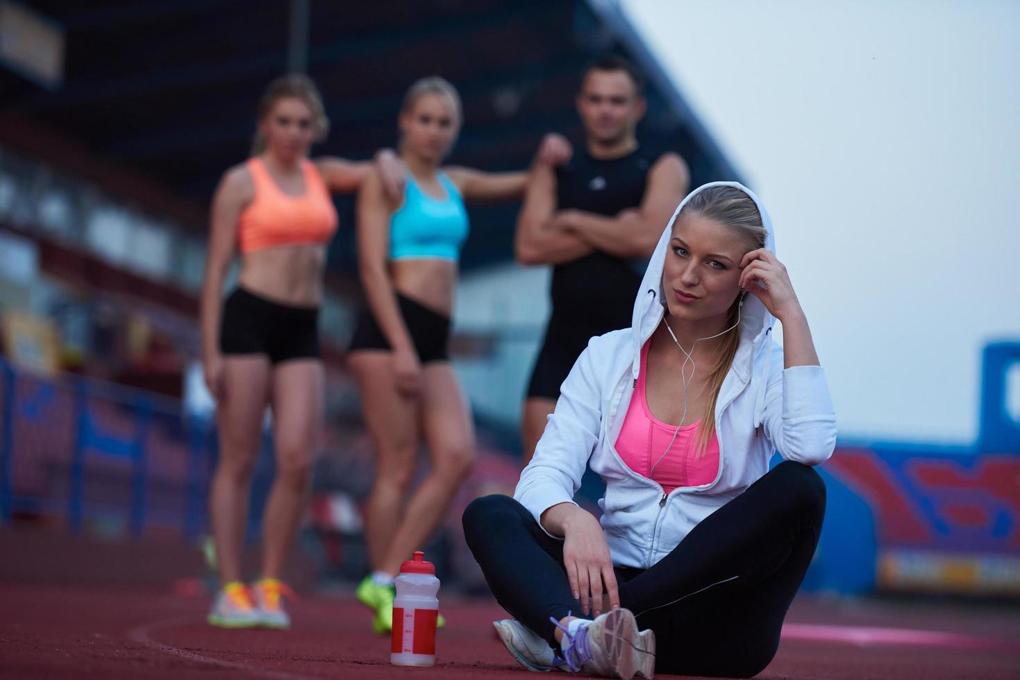 sporty woman on athletic race track photo