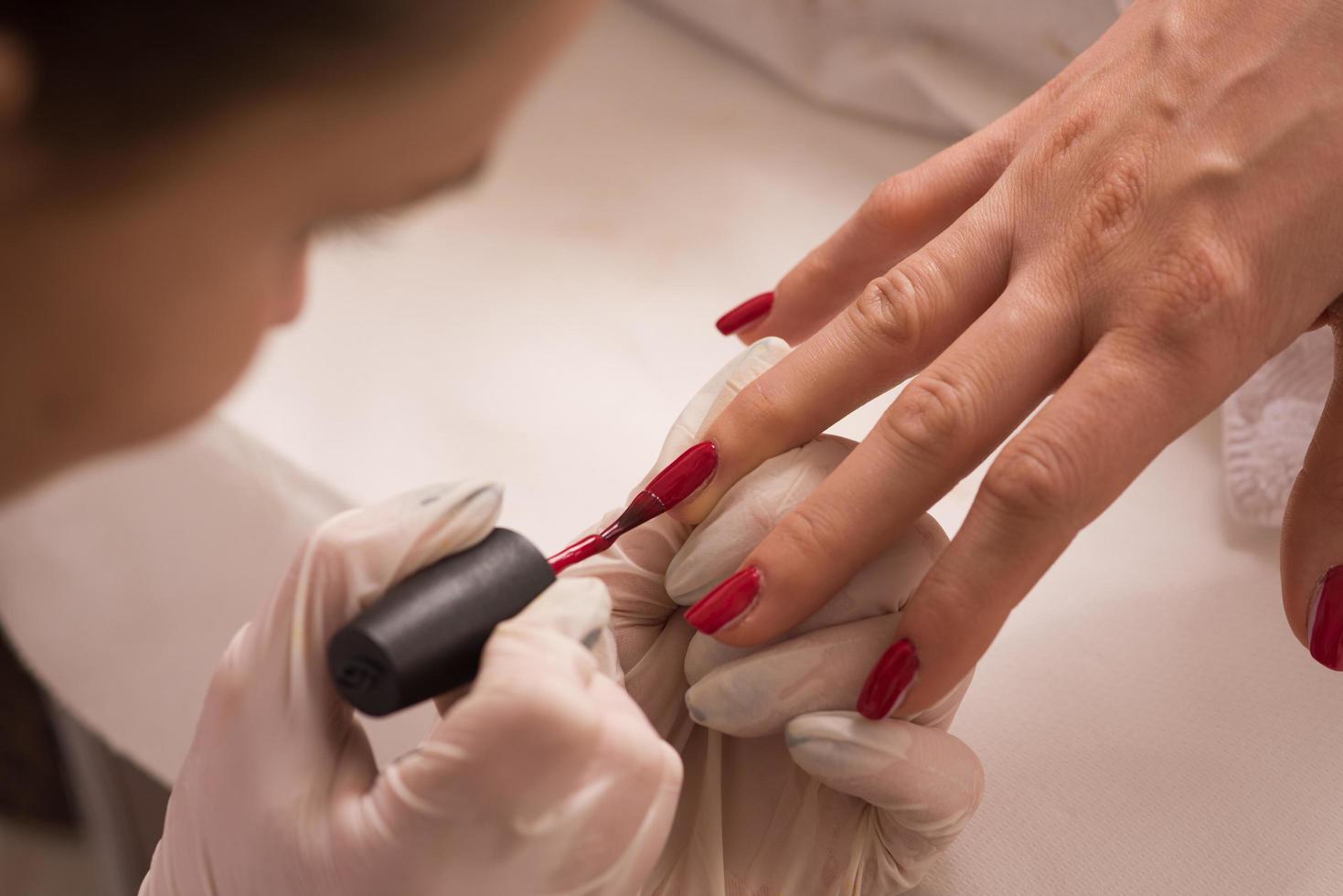 Woman hands receiving a manicure photo