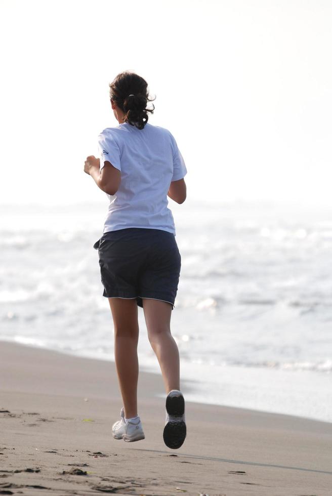 Runner on beach photo