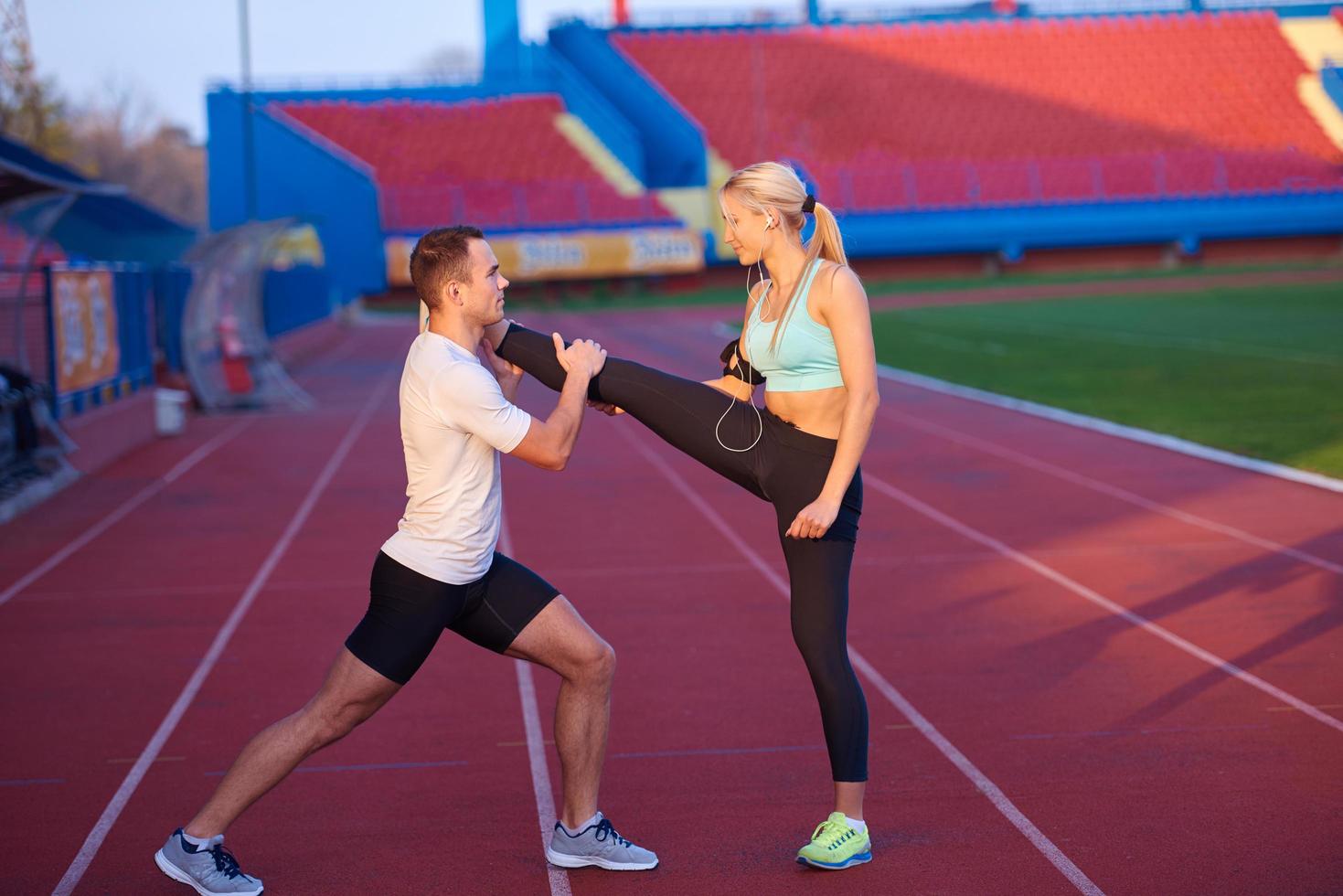 sporty woman on athletic race track photo