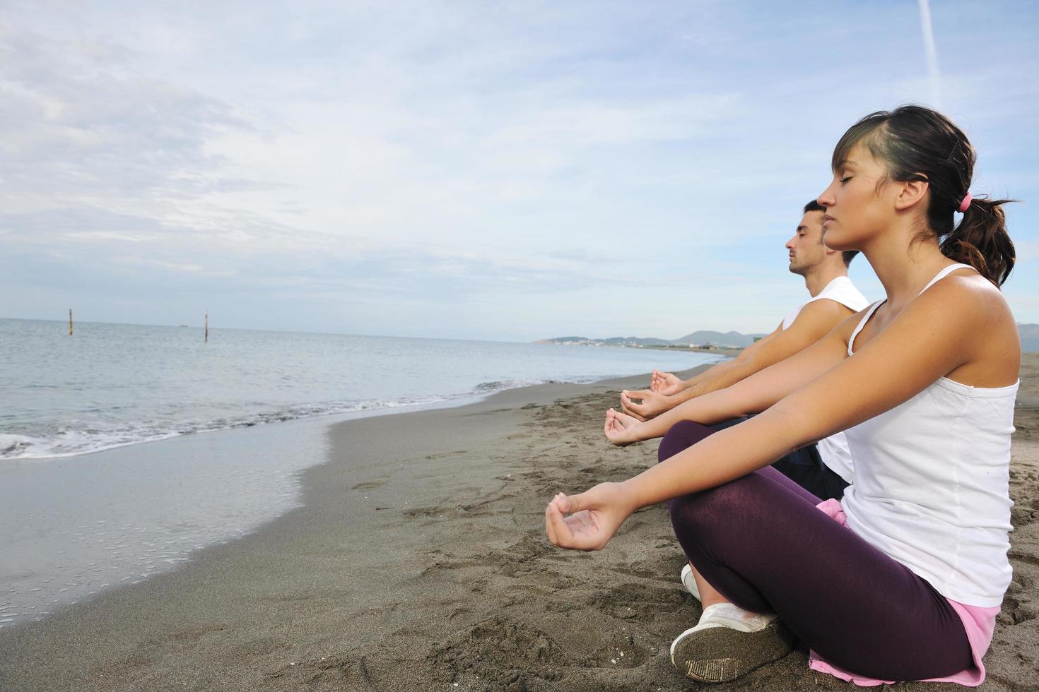 couple yoga beach photo