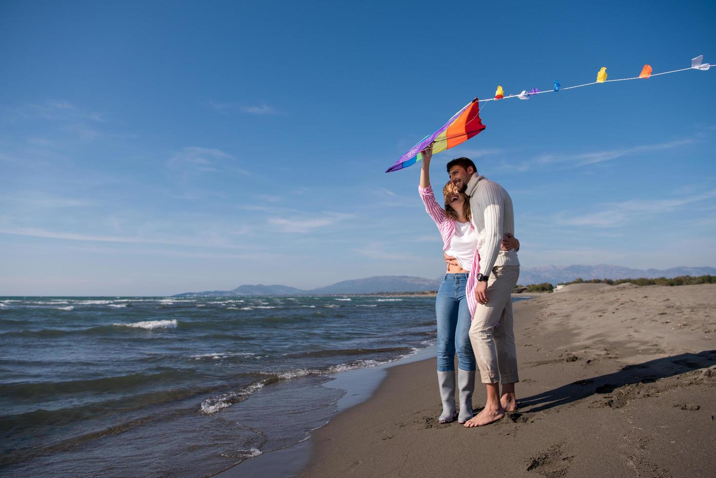 Couple enjoying time together at beach photo