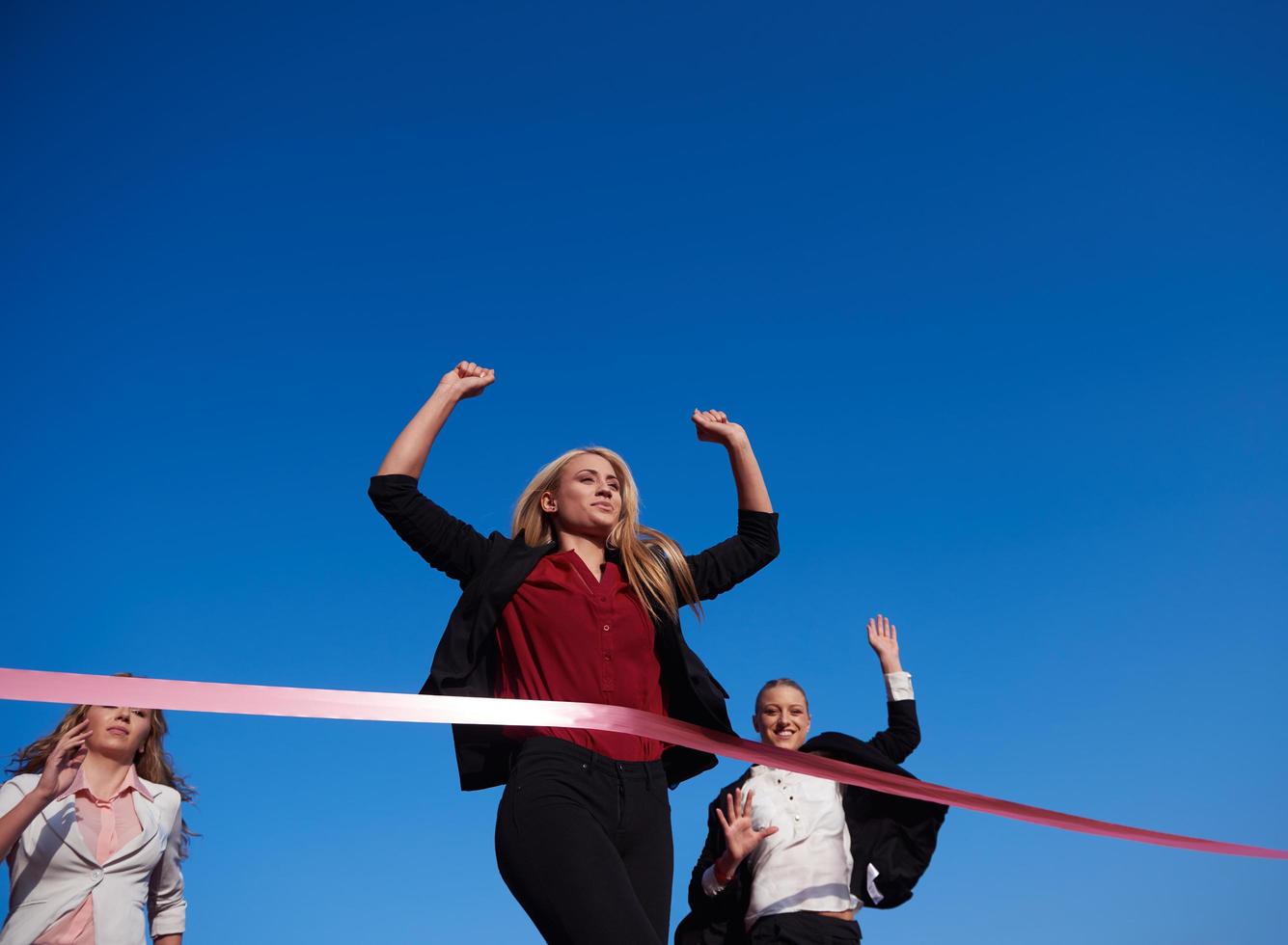 business people running on racing track photo