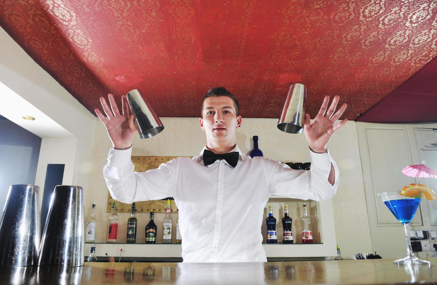 pro barman prepare coctail drink on party photo
