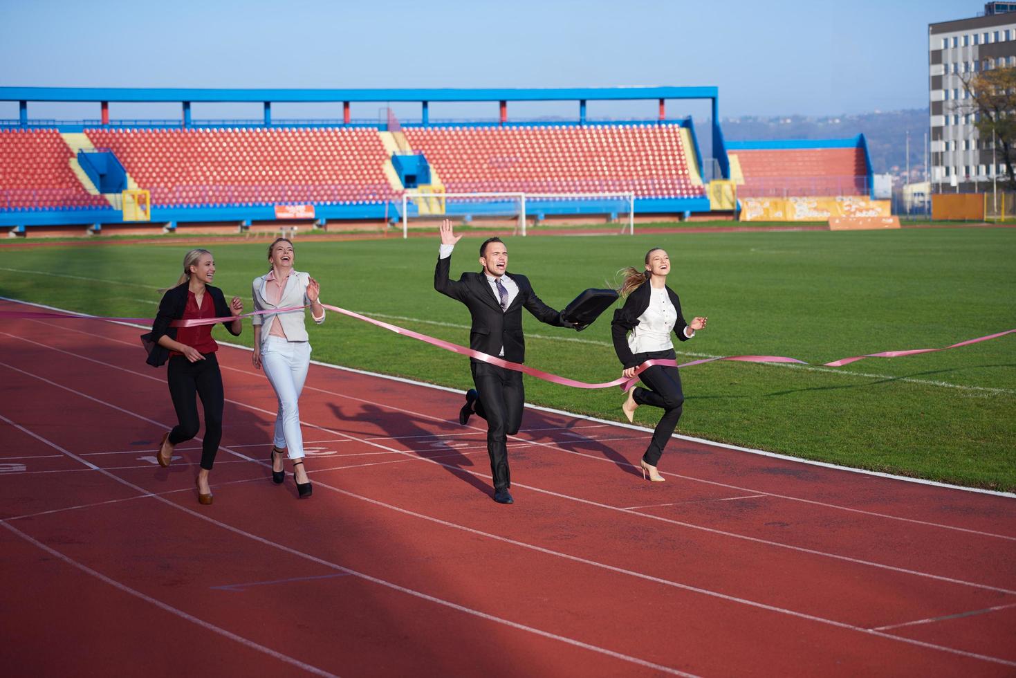 business people running on racing track photo