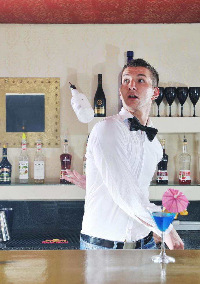 pro barman prepare coctail drink on party photo