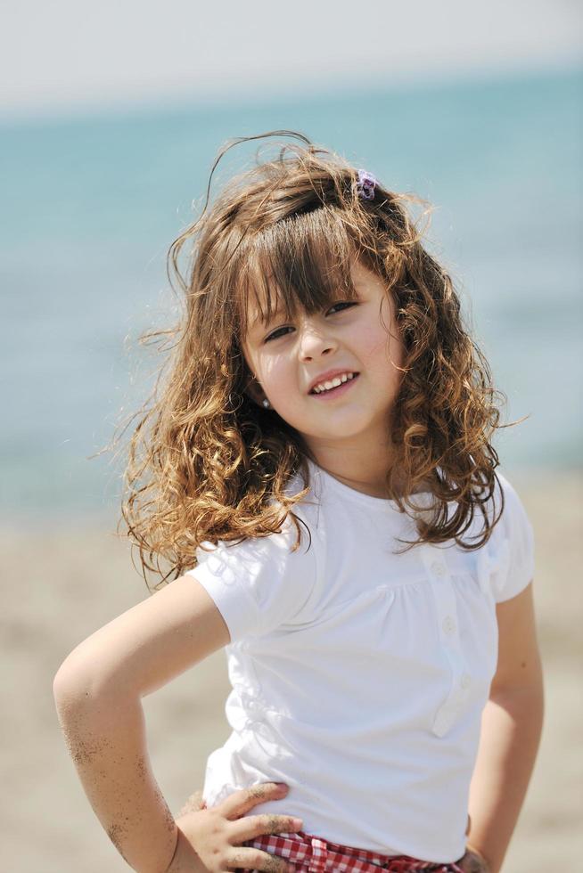 little female  child portrait on the beach photo