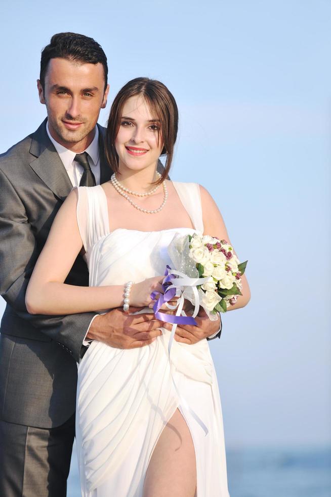 romantic beach wedding at sunset photo