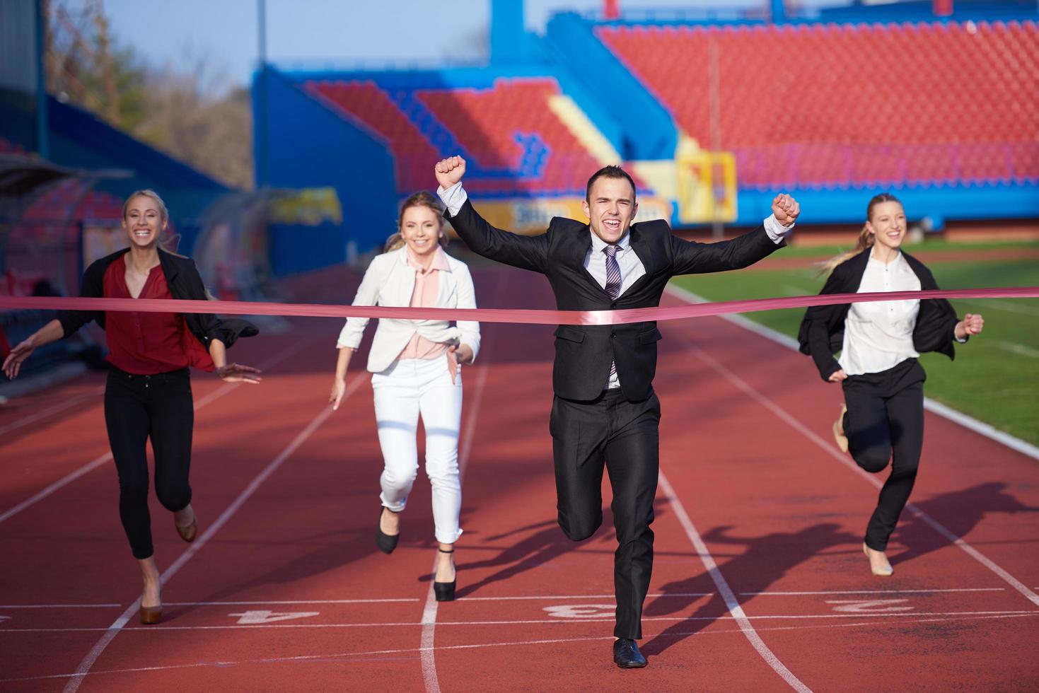 business people running on racing track photo