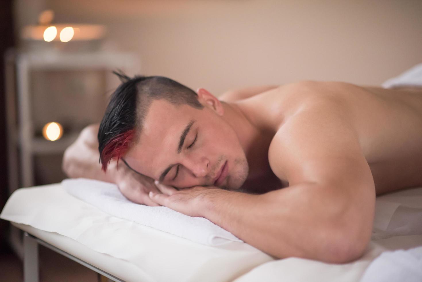 handsome man resting in a spa massage center photo