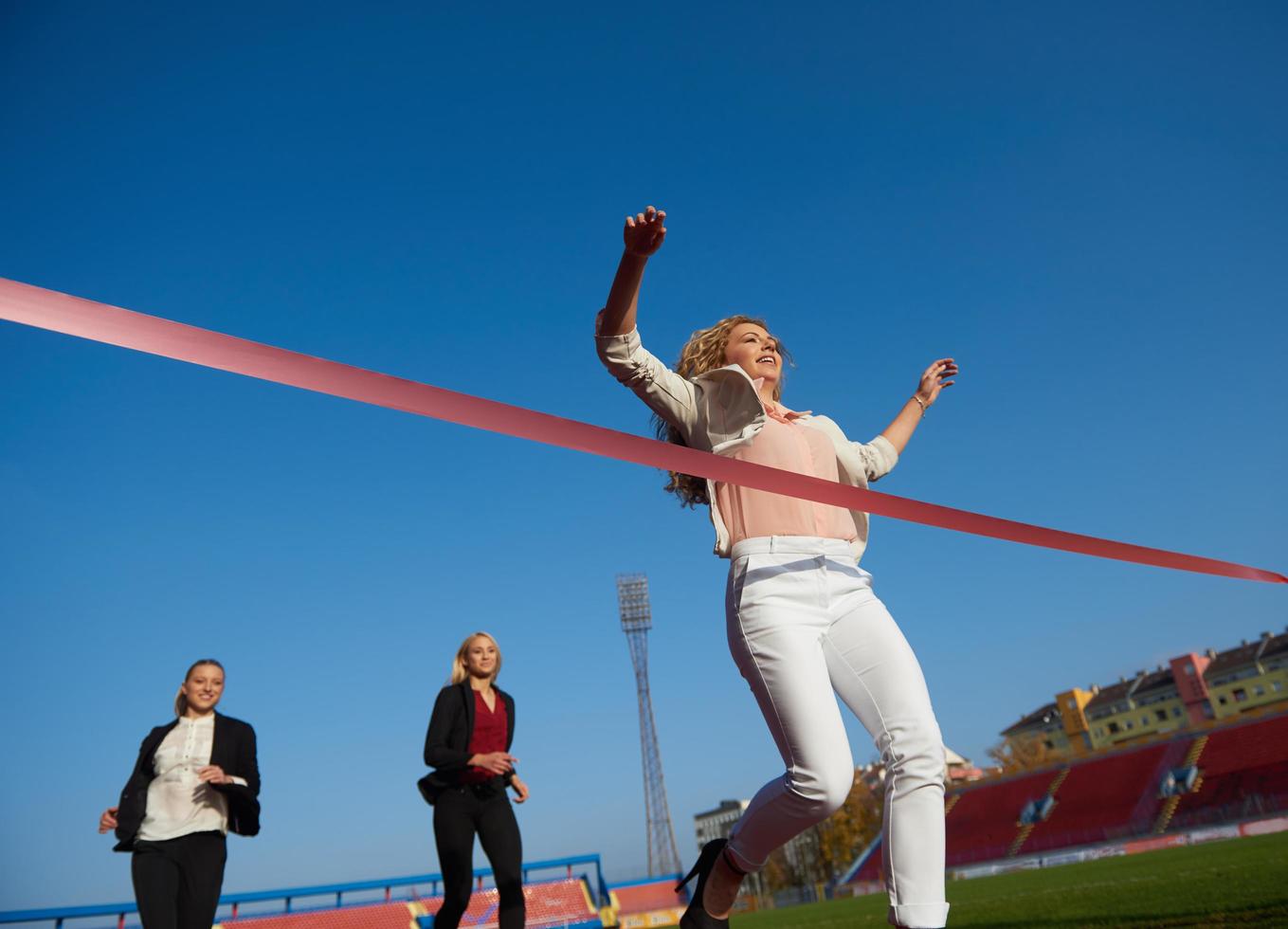 business people running on racing track photo