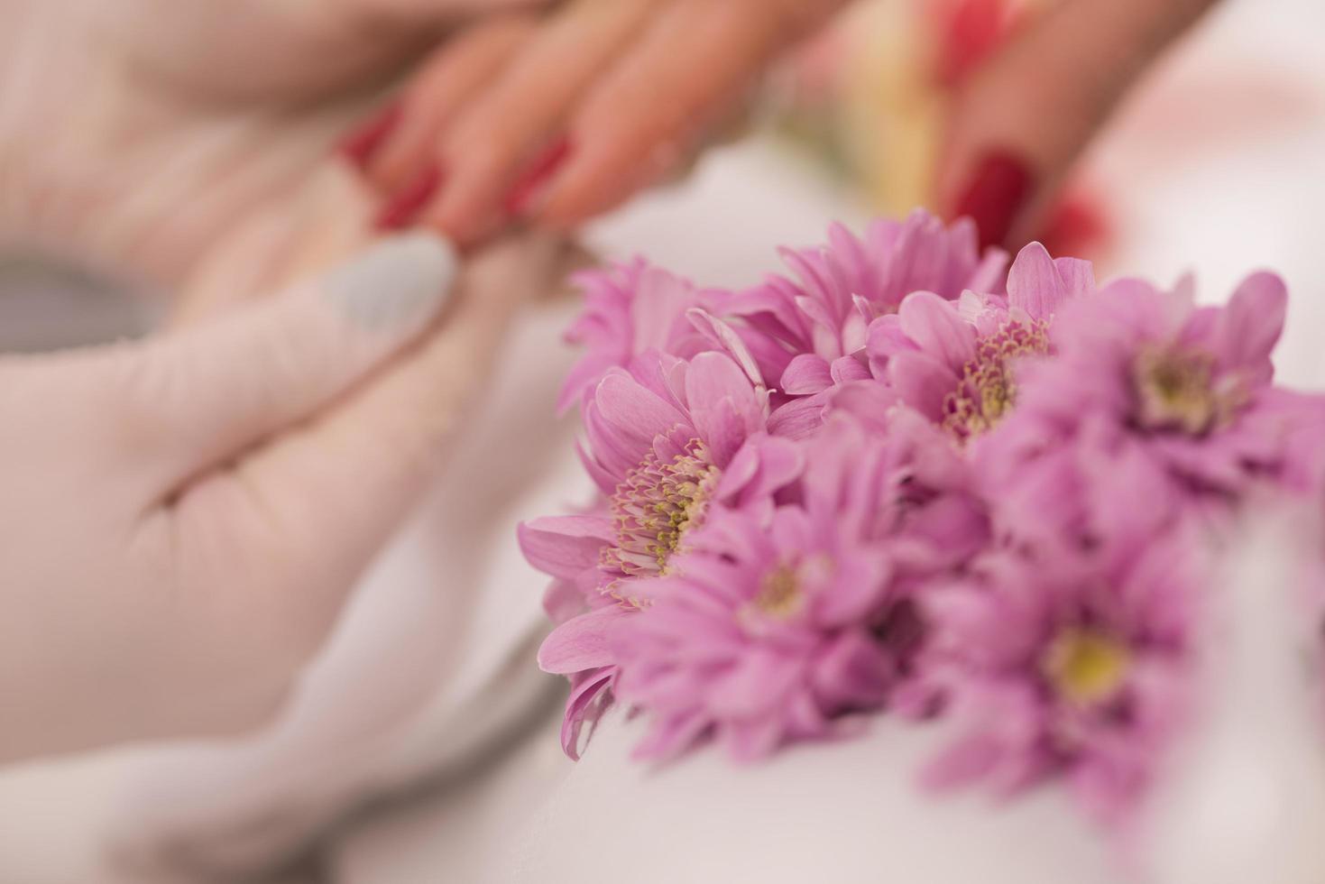 Woman hands receiving a manicure photo