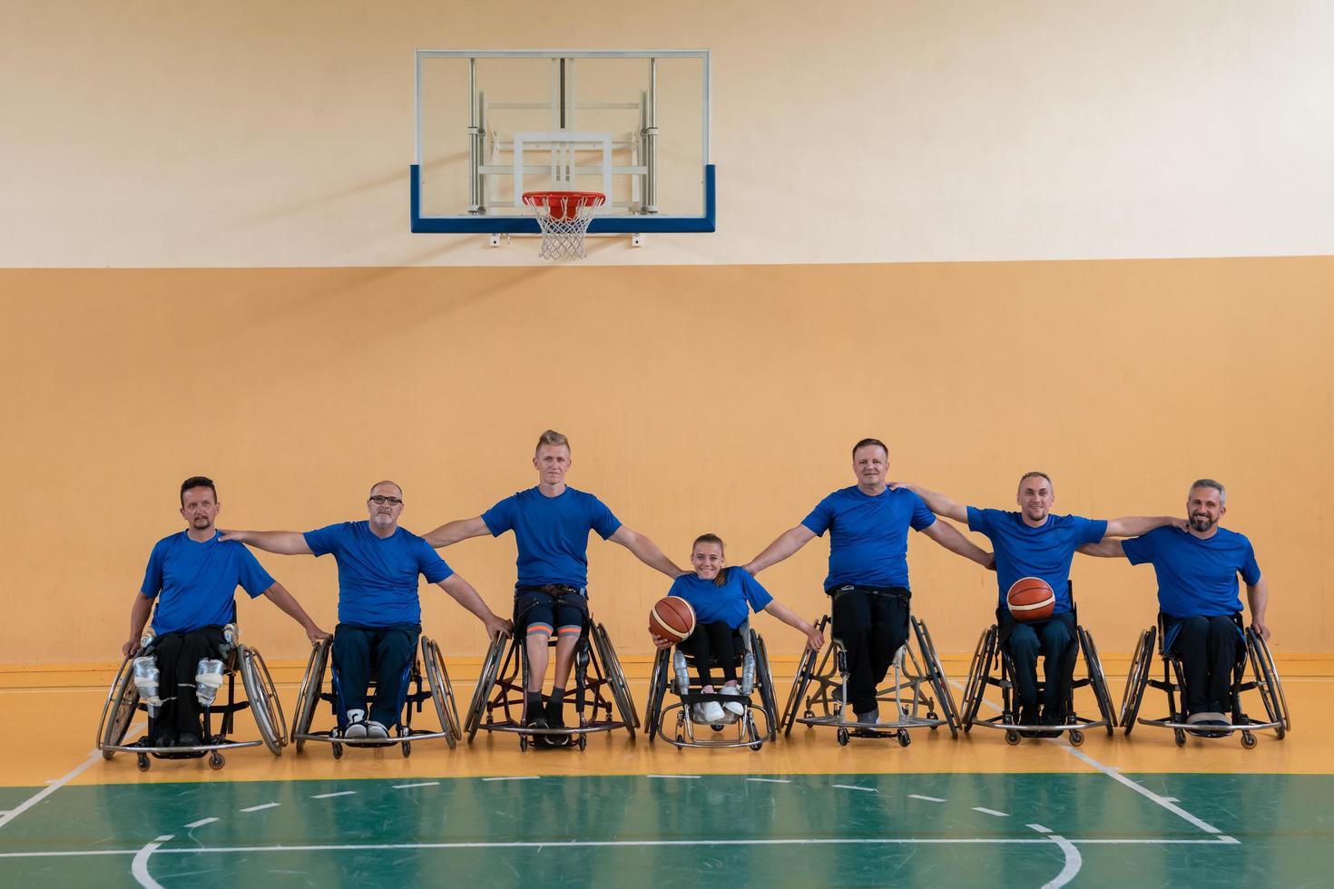 photo of the basketball team of war invalids with professional sports equipment for people with disabilities on the basketball court