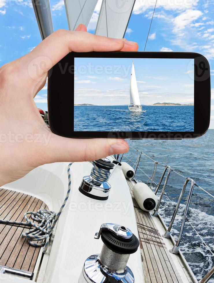 taking photo of white sail yacht in Adriatic sea