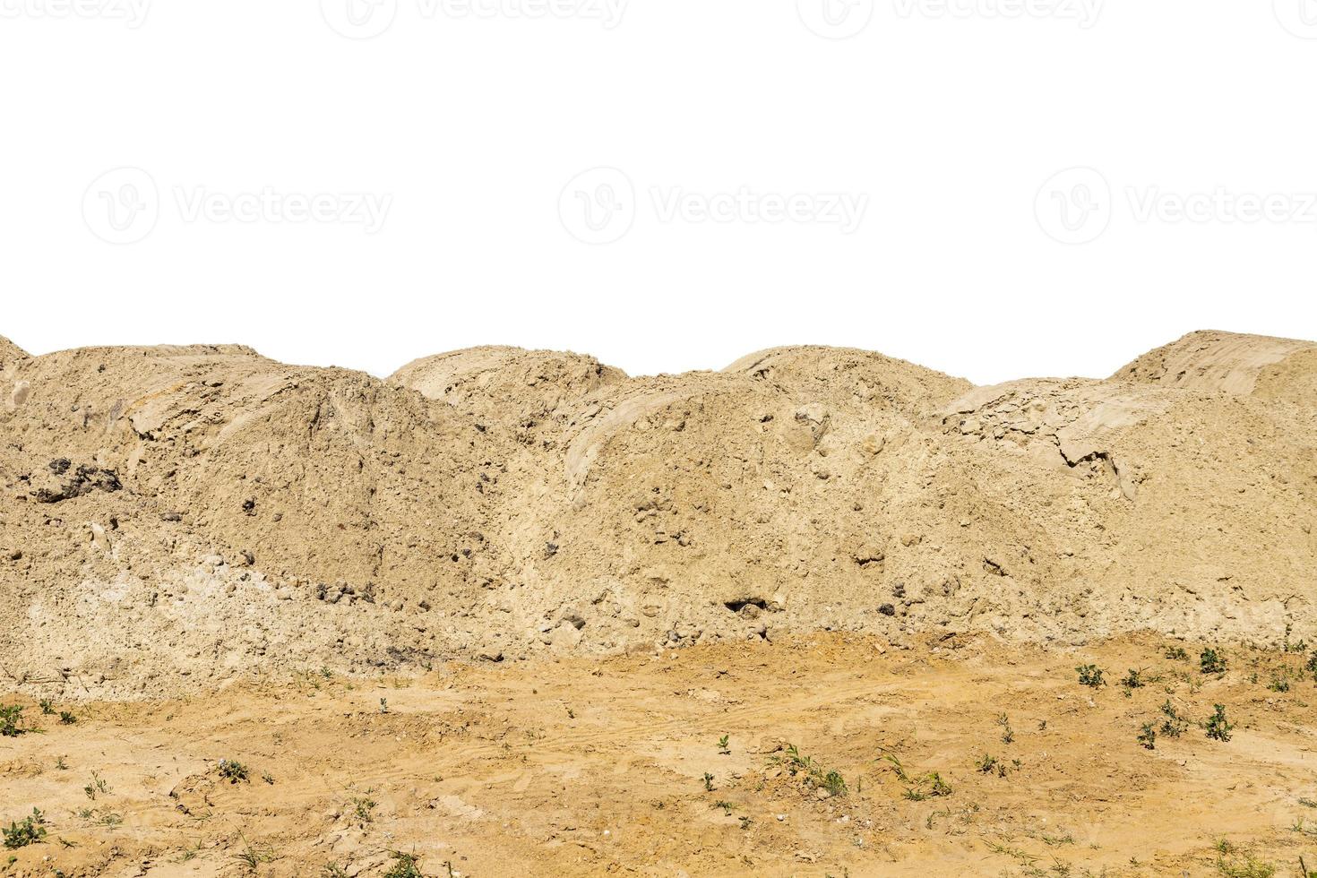 Construction site with heaps of sand. Pile of sand on an isolated white background. copy space. photo