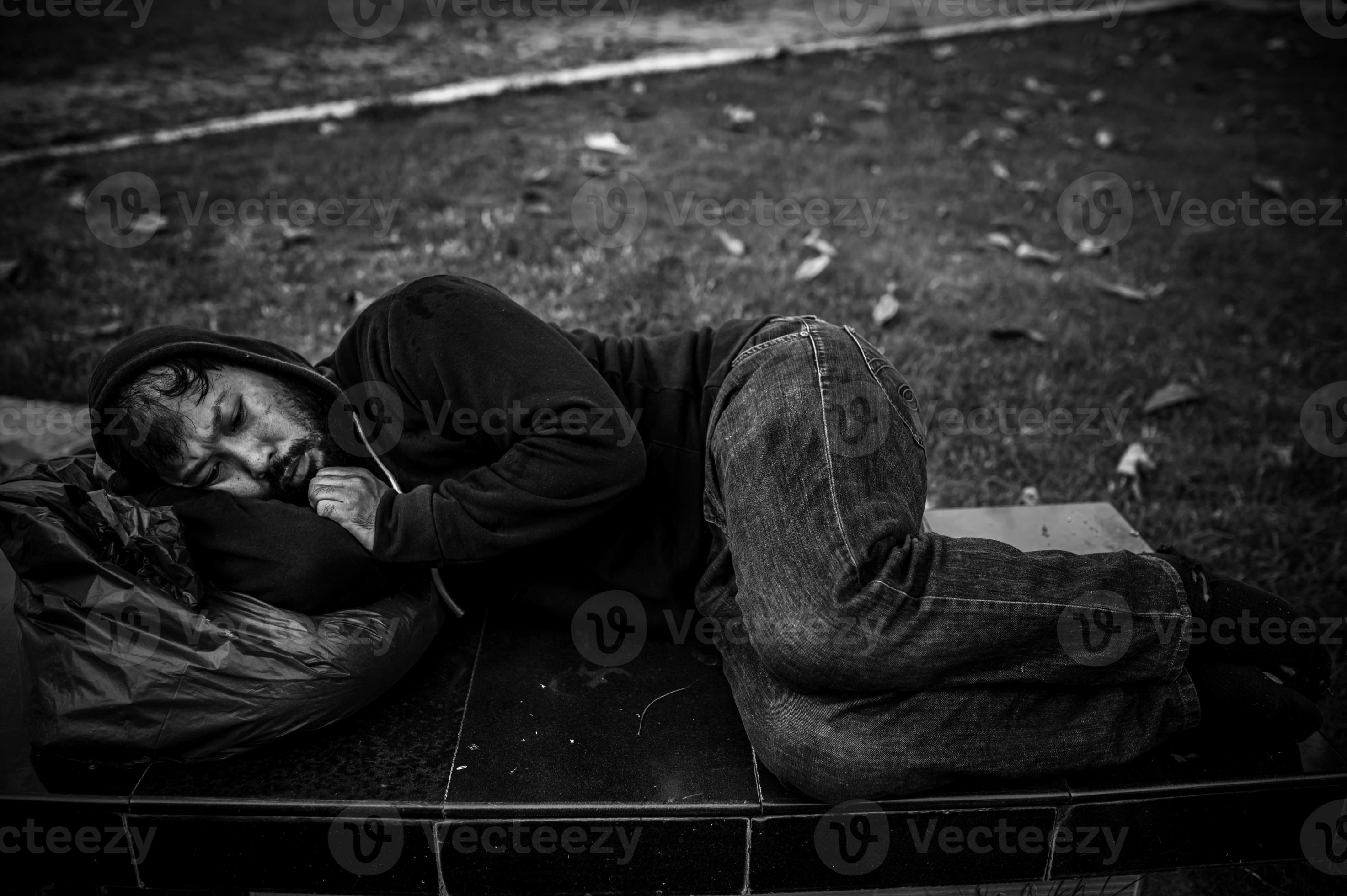 Asian man is homeless at the side road,A stranger has to live on the road alone because he has