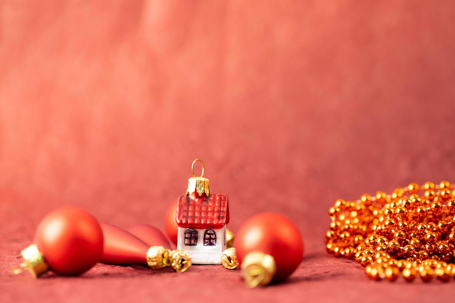 Winter Holiday House on a red background. Festive banner photo