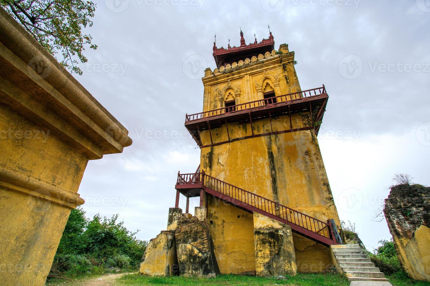 Nanmyin Watch Tower, or Leaning Tower of Inwa, the remains of the stately Palace reared by King Bagyidaw in Inwa, or Ava, Mandalay, Myanmar photo