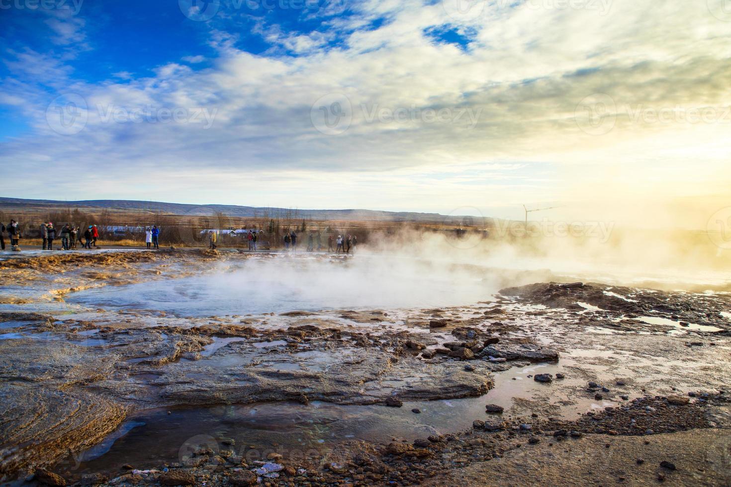 Strokkur, one of the most famous geysers located in a geothermal area beside the Hvita River in the southwest part of Iceland, erupting once every 6-10 minutes photo