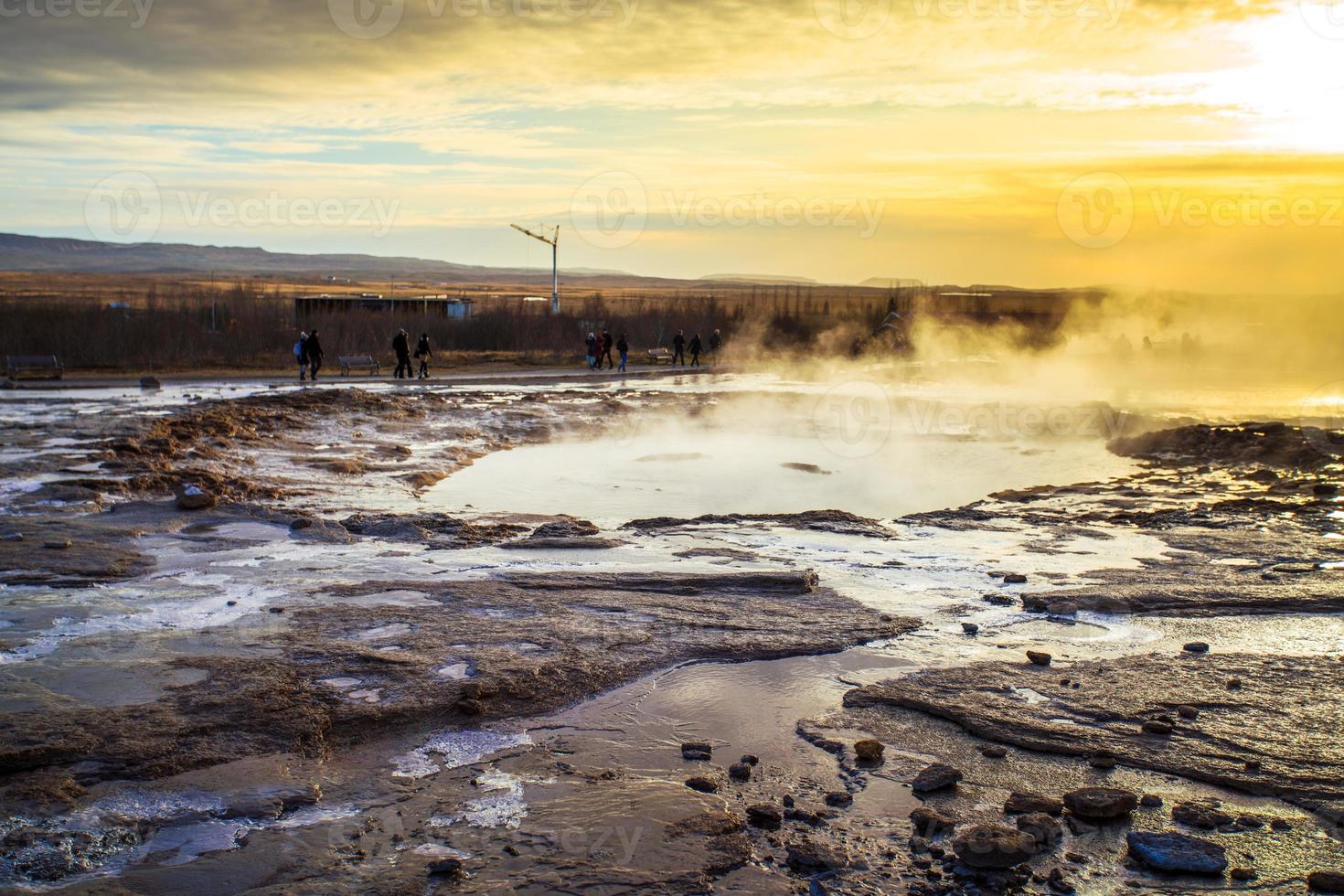 Strokkur, one of the most famous geysers located in a geothermal area beside the Hvita River in the southwest part of Iceland, erupting once every 6-10 minutes photo