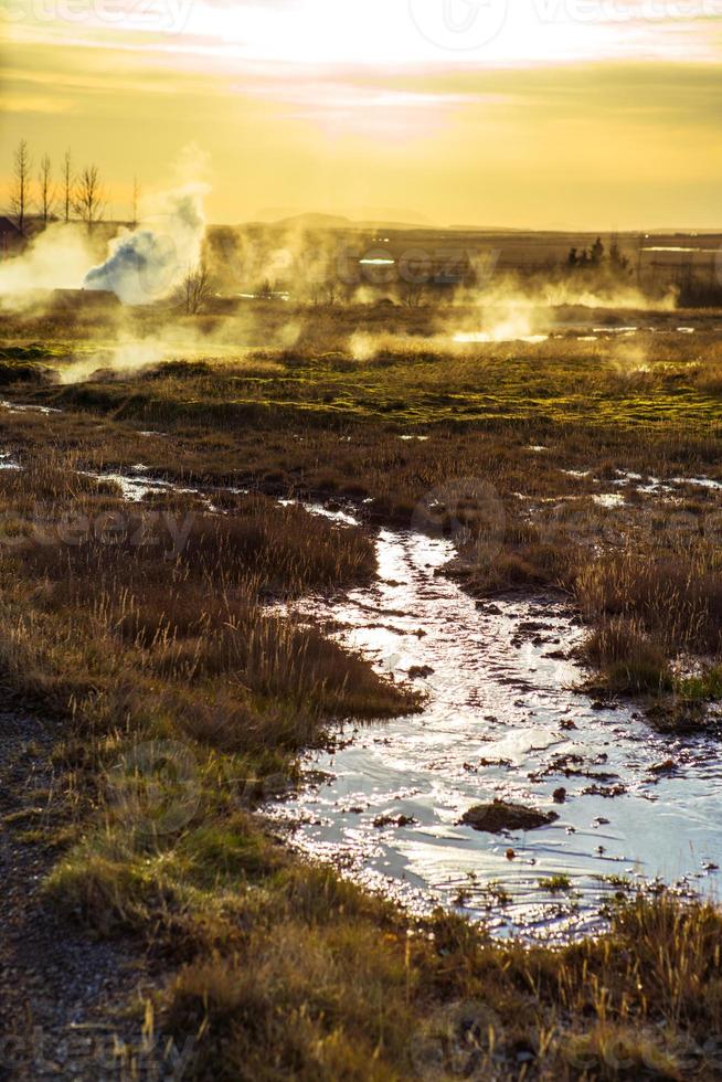 Strokkur, one of the most famous geysers located in a geothermal area beside the Hvita River in the southwest part of Iceland, erupting once every 6-10 minutes photo