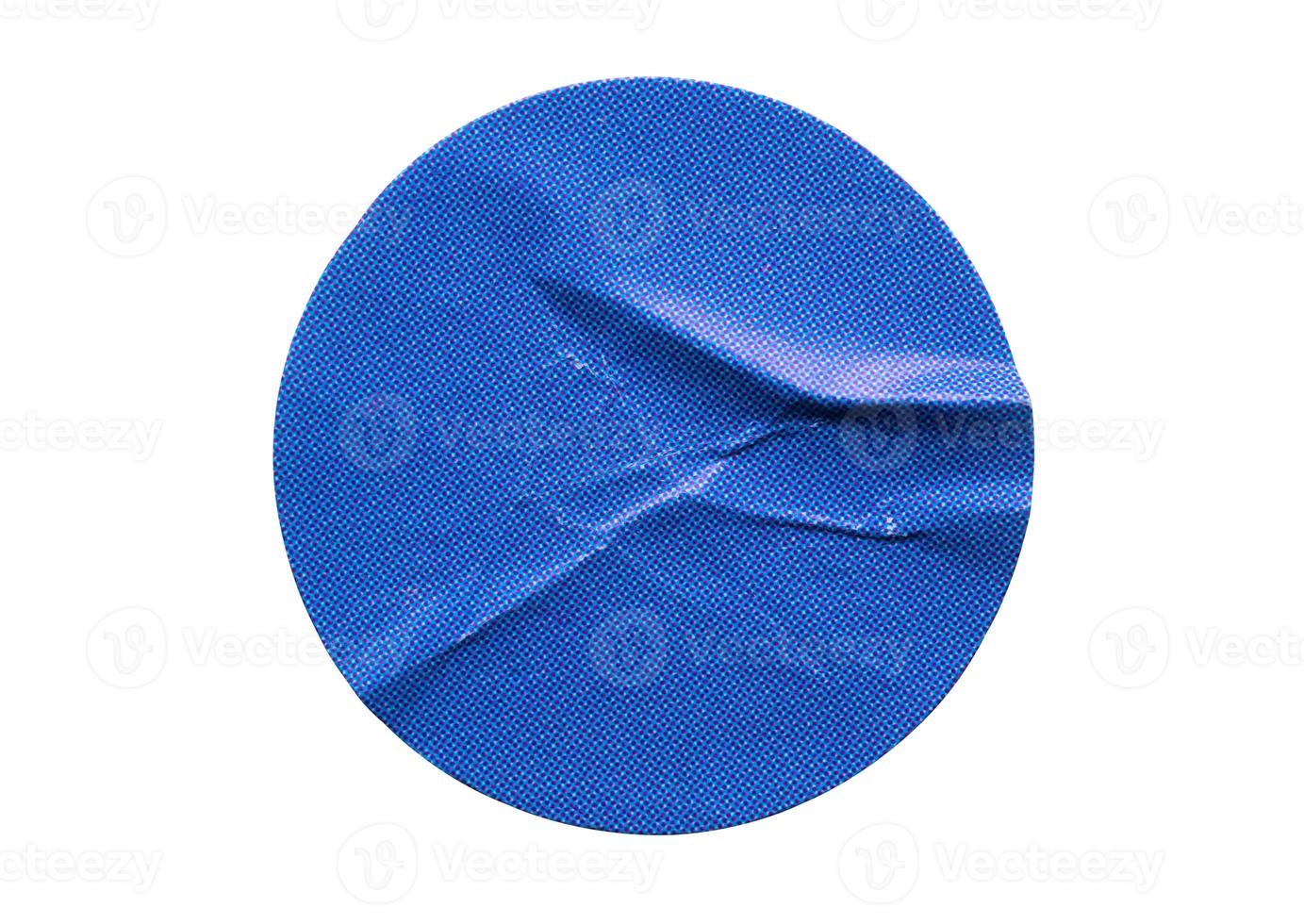 Blank blue round adhesive paper sticker label isolated on white background photo