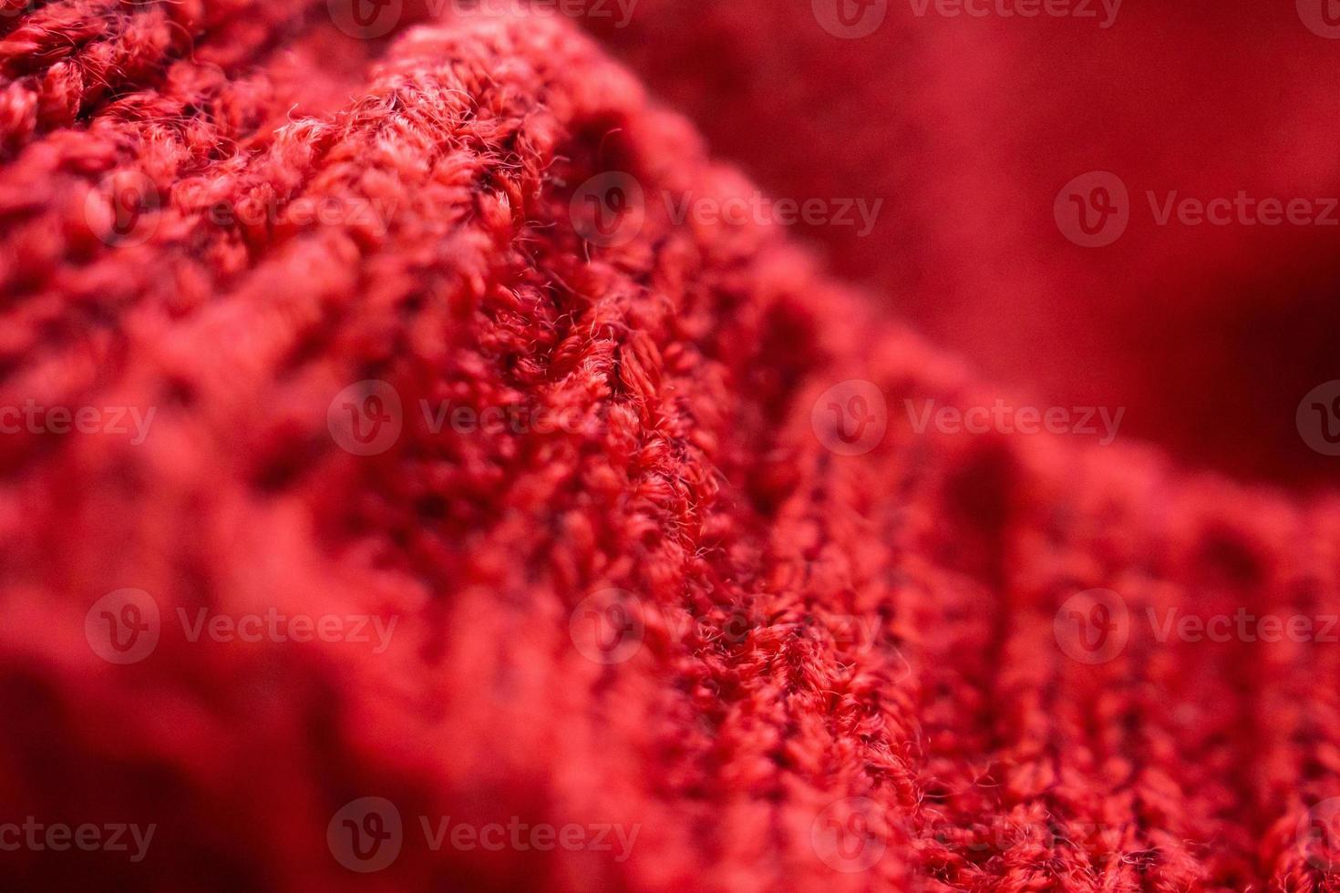 closeup red knitted woolen fabric texture background photo