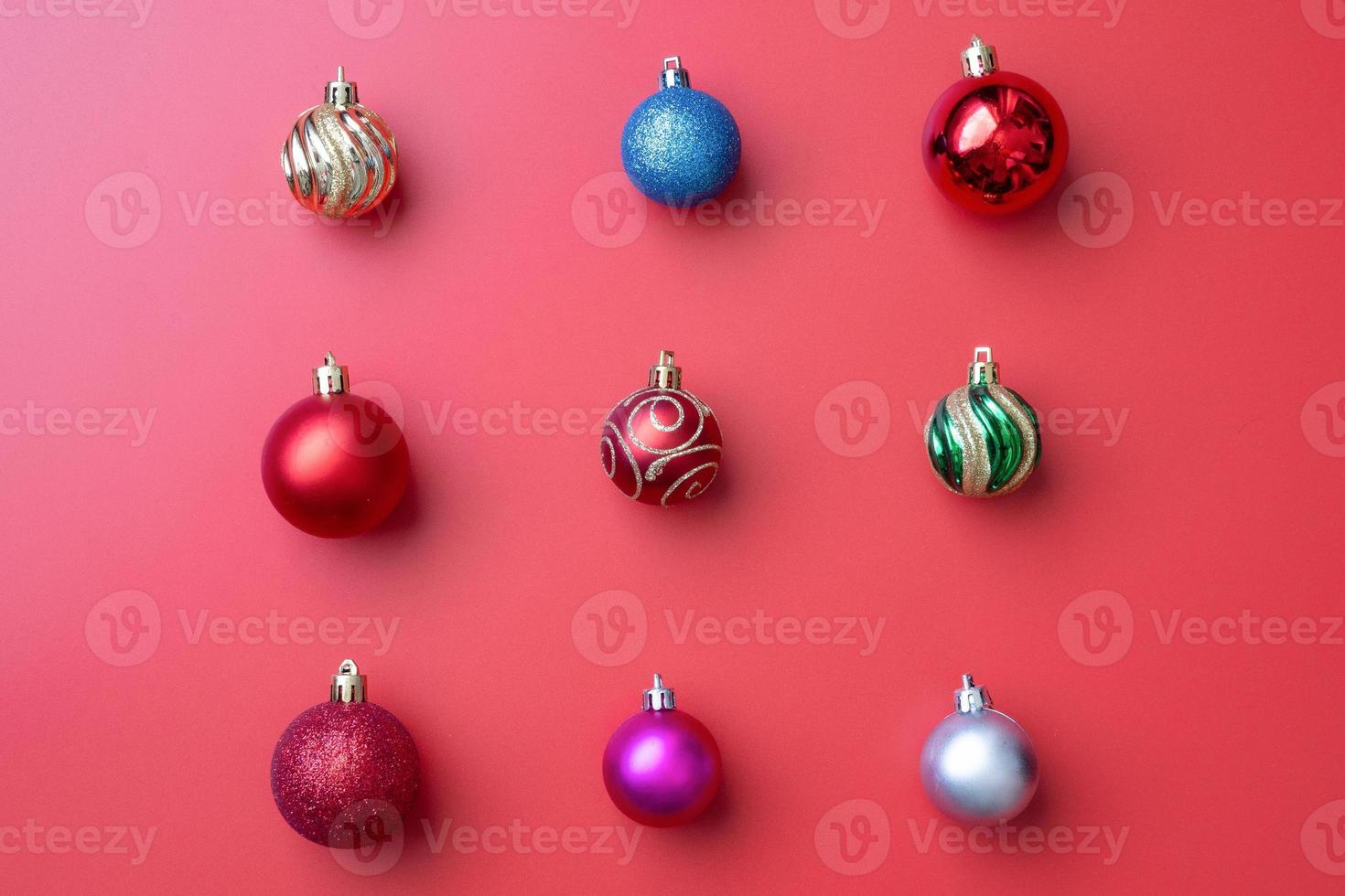 Christmas ball bauble pattern minimal flatlay on red background top view photo