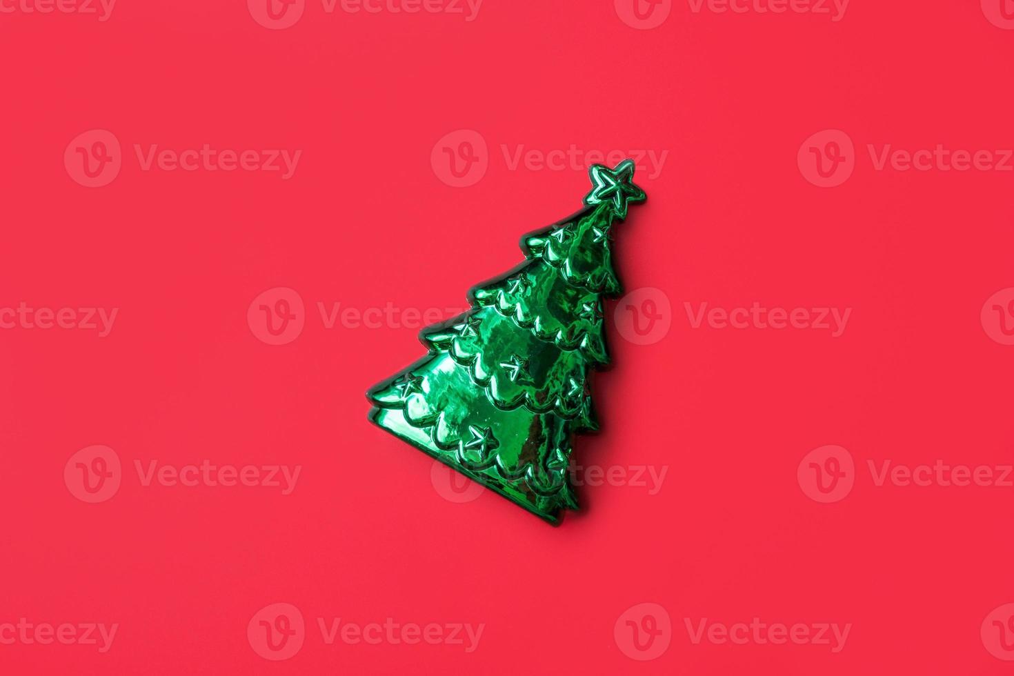 Christmas tree on red background new year holiday celebration concept photo
