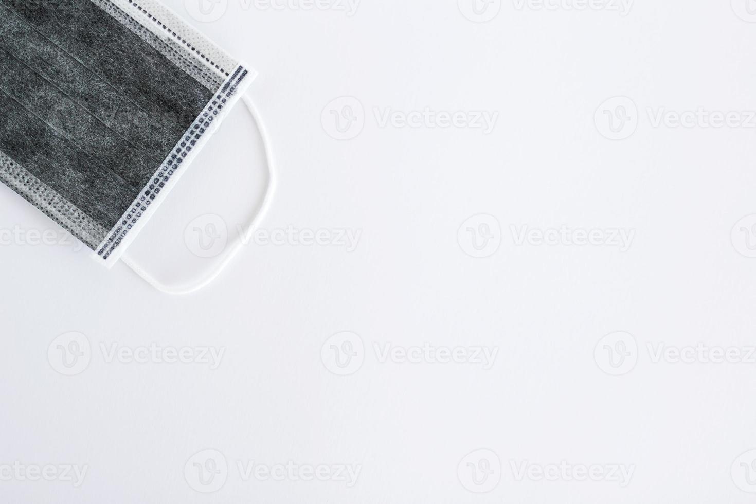 Flat lay on medical face mask on white background with copy space. photo