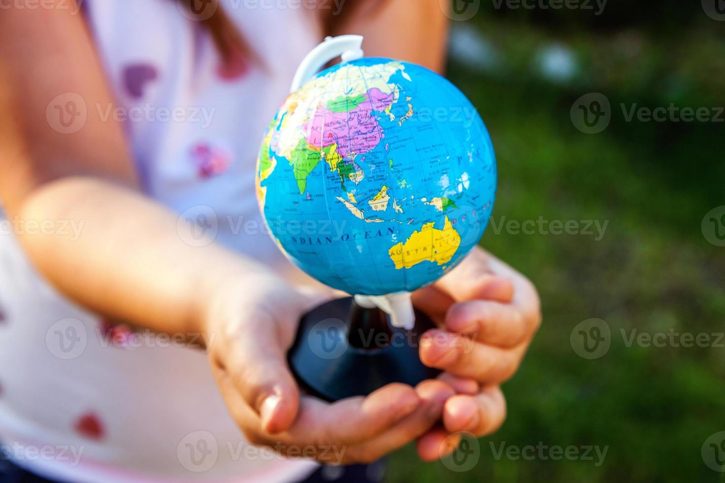 Earth globe in children hands photo