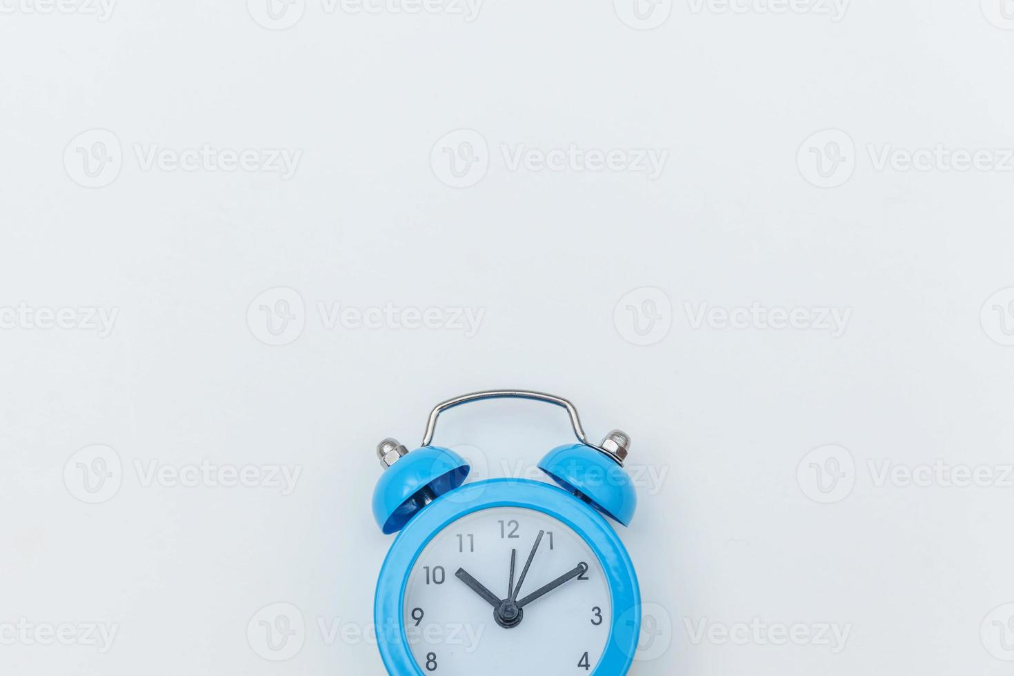 Simply flat lay design Ringing twin bell vintage classic alarm clock Isolated on white background. Rest hours time of life good morning night wake up awake concept. Flat lay top view copy space. photo