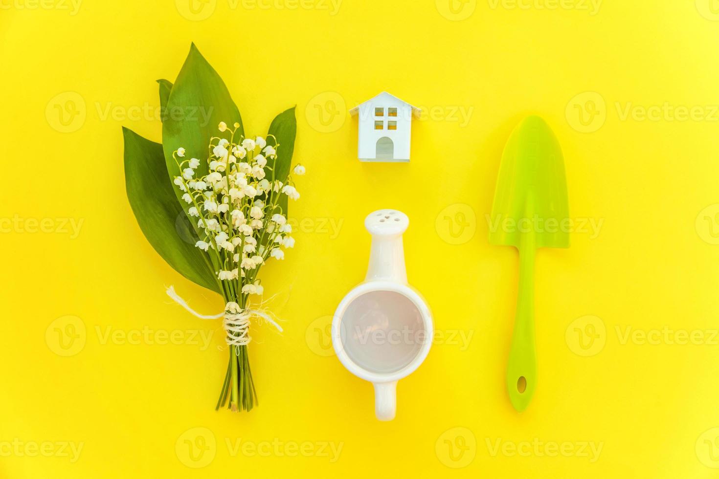 Flat Lay with gardening tools on yellow background photo