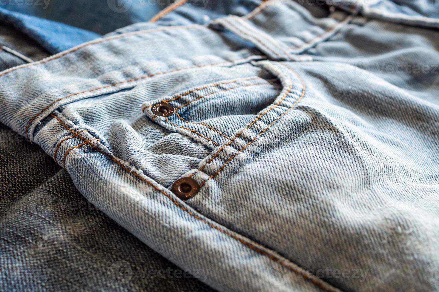 many denim blue jeans background photo