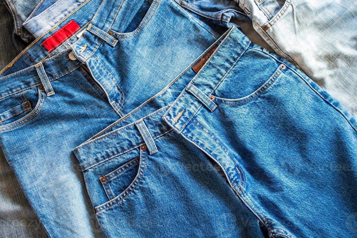 many denim blue jeans background photo