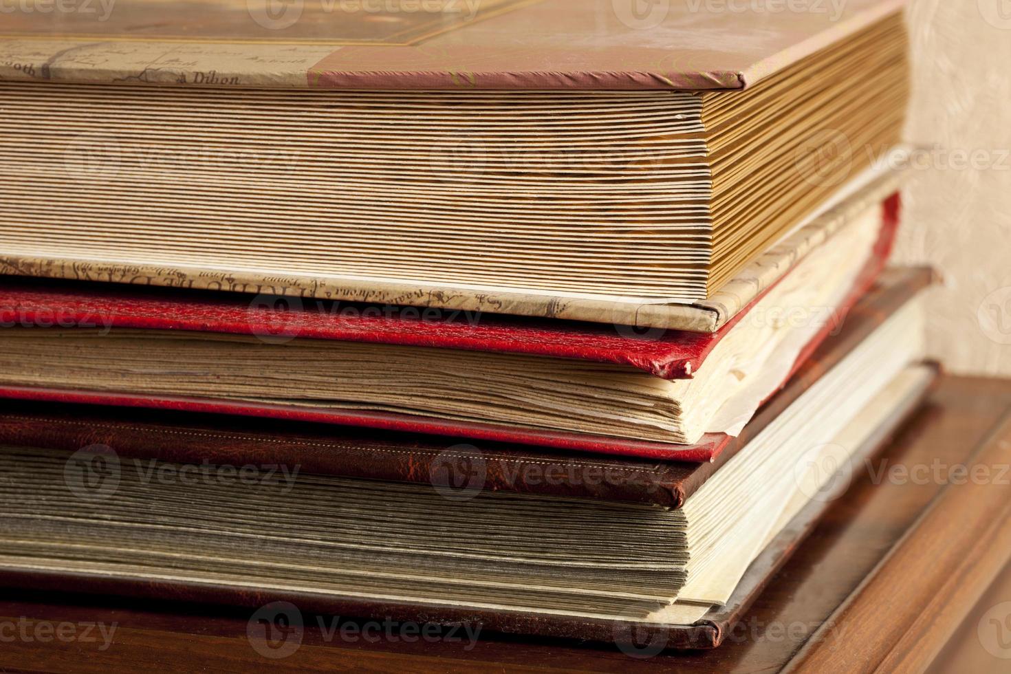 old photo album are stacked on top of each other