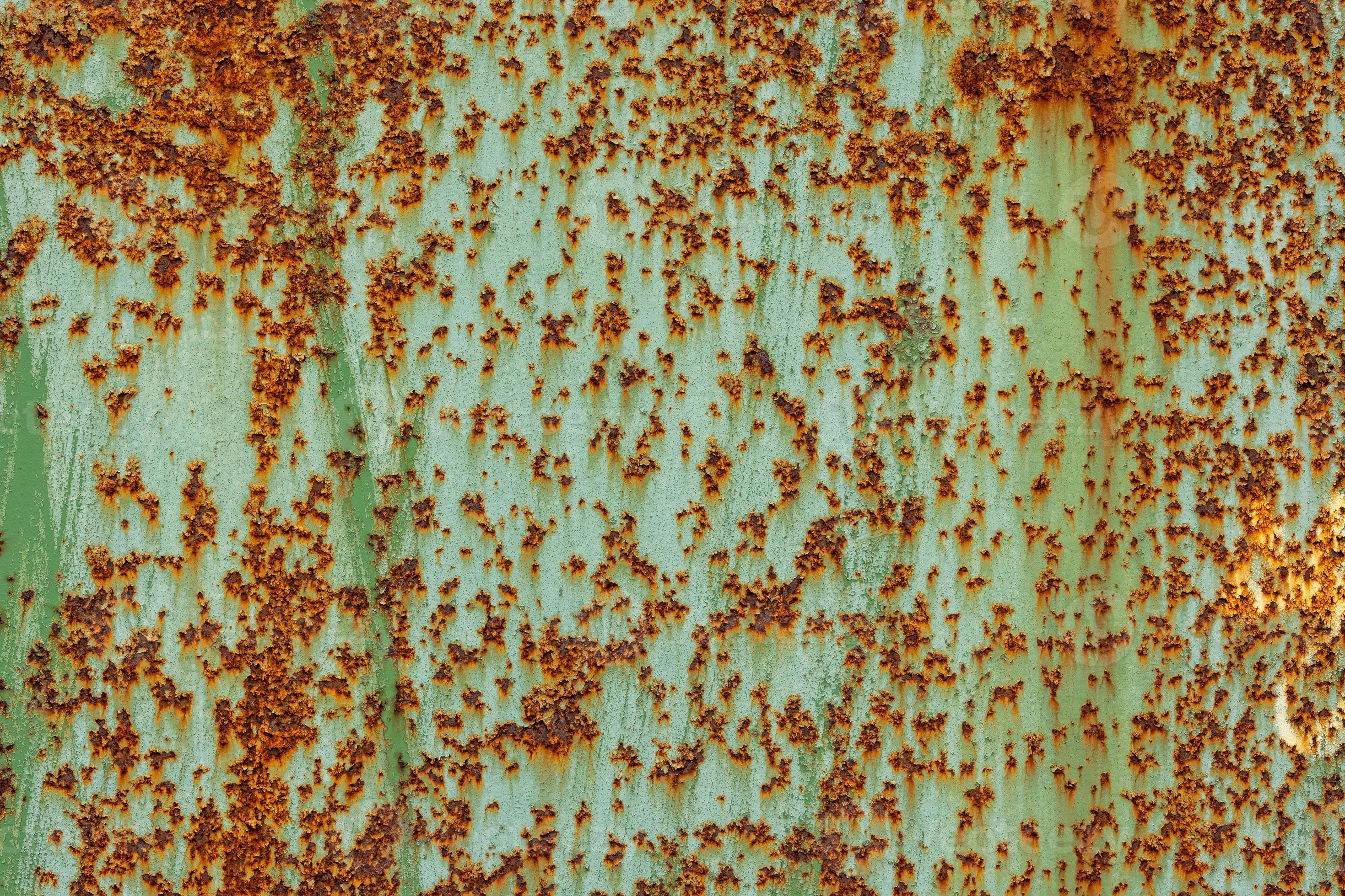 peeled off green paint on flat rusted sheet metal surface 12670294