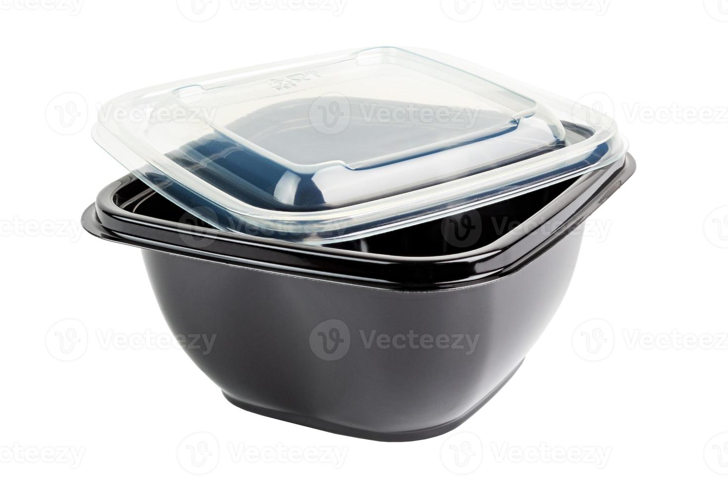 Black opaque single-use PET - Polyethylene terephthalate -plastic food take-out container with tranparent cover, isolated. photo