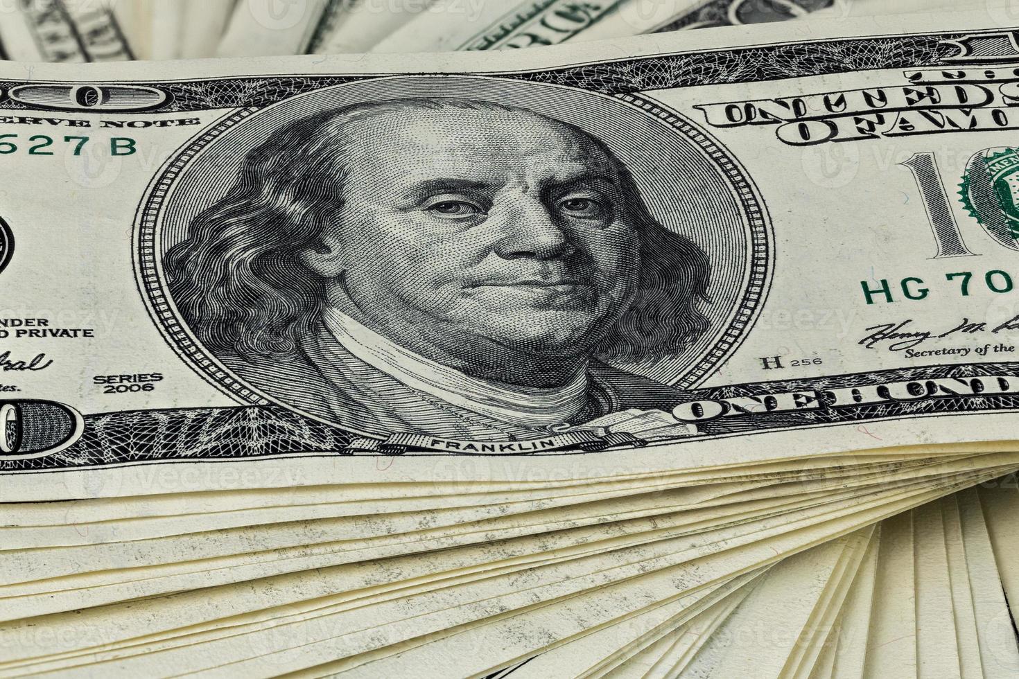 a skewed stack of old us dollar banknotes - close shot photo