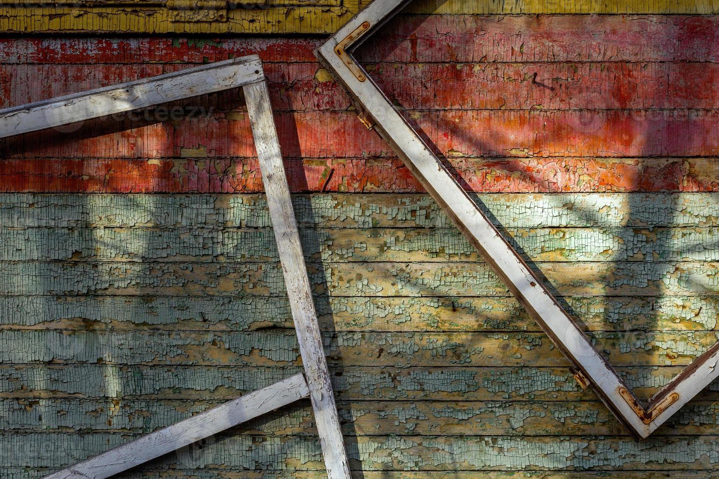 Abstract composition with a frames on old wooden wall photo