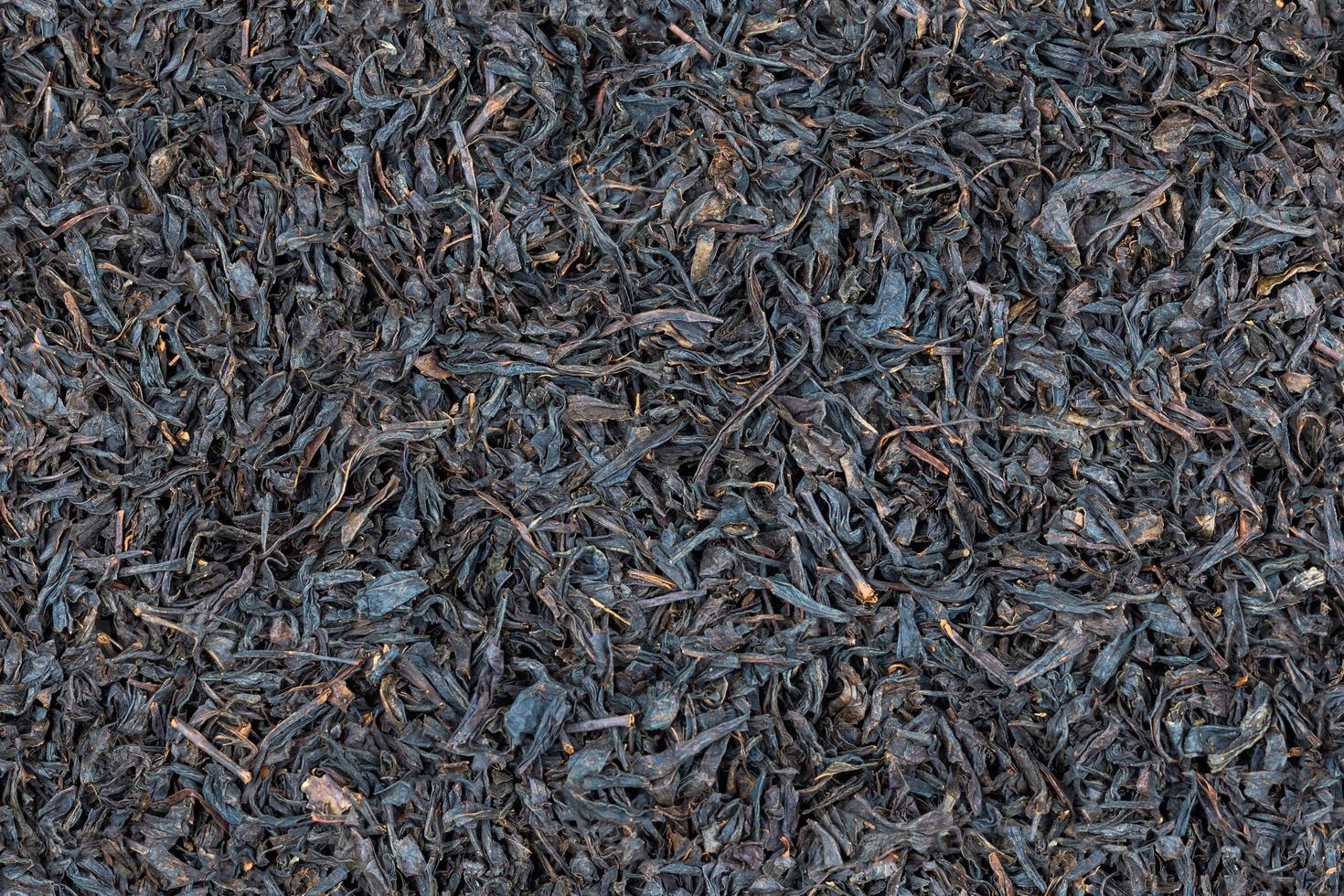 seamless texture and full frame background of flat pile of dry long-term black tea photo
