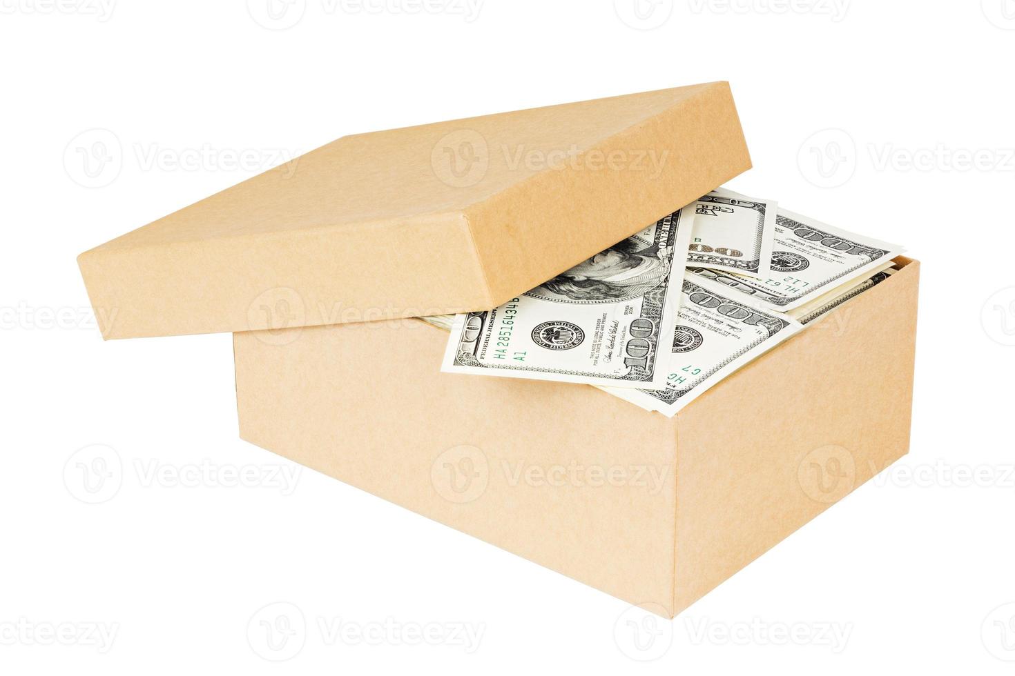a small cardboard box full of dollar banknotes isolated on white background photo