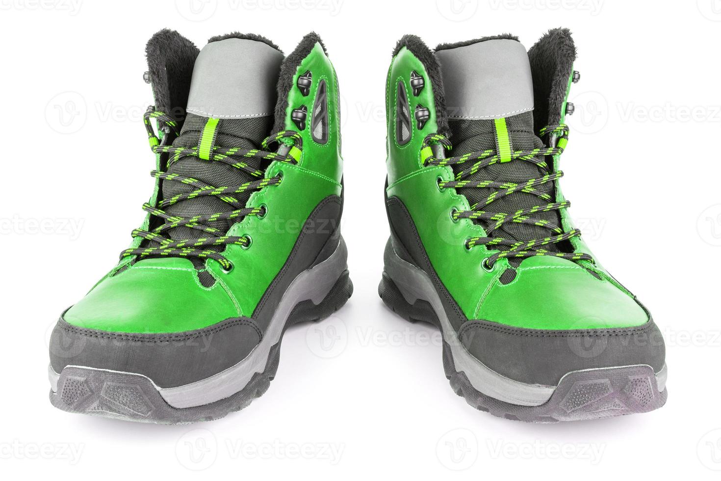 pair of green insulated winter warm three quarter sneaker or boot isolated on white background photo