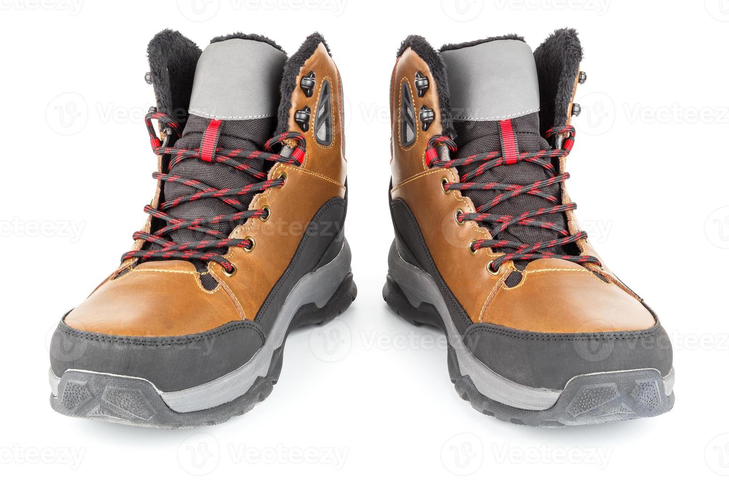 pair of brown insulated winter warm three quarter sneaker or boot isolated on white background photo