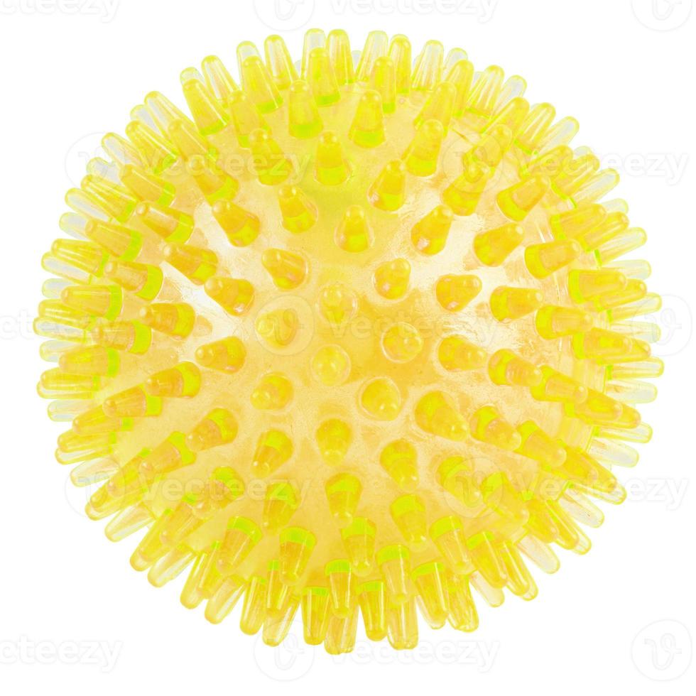 transparent yellow spiked plastic ball isolated on white background - massager, dog toy and COVID-19 symbol photo